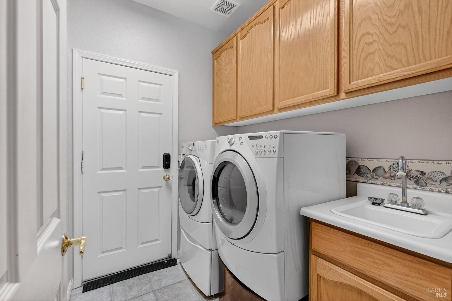 1024 Vintage Drive Rio Vista, CA 94571 - Photo 20 of 52 a utility room with sink dryer and washer