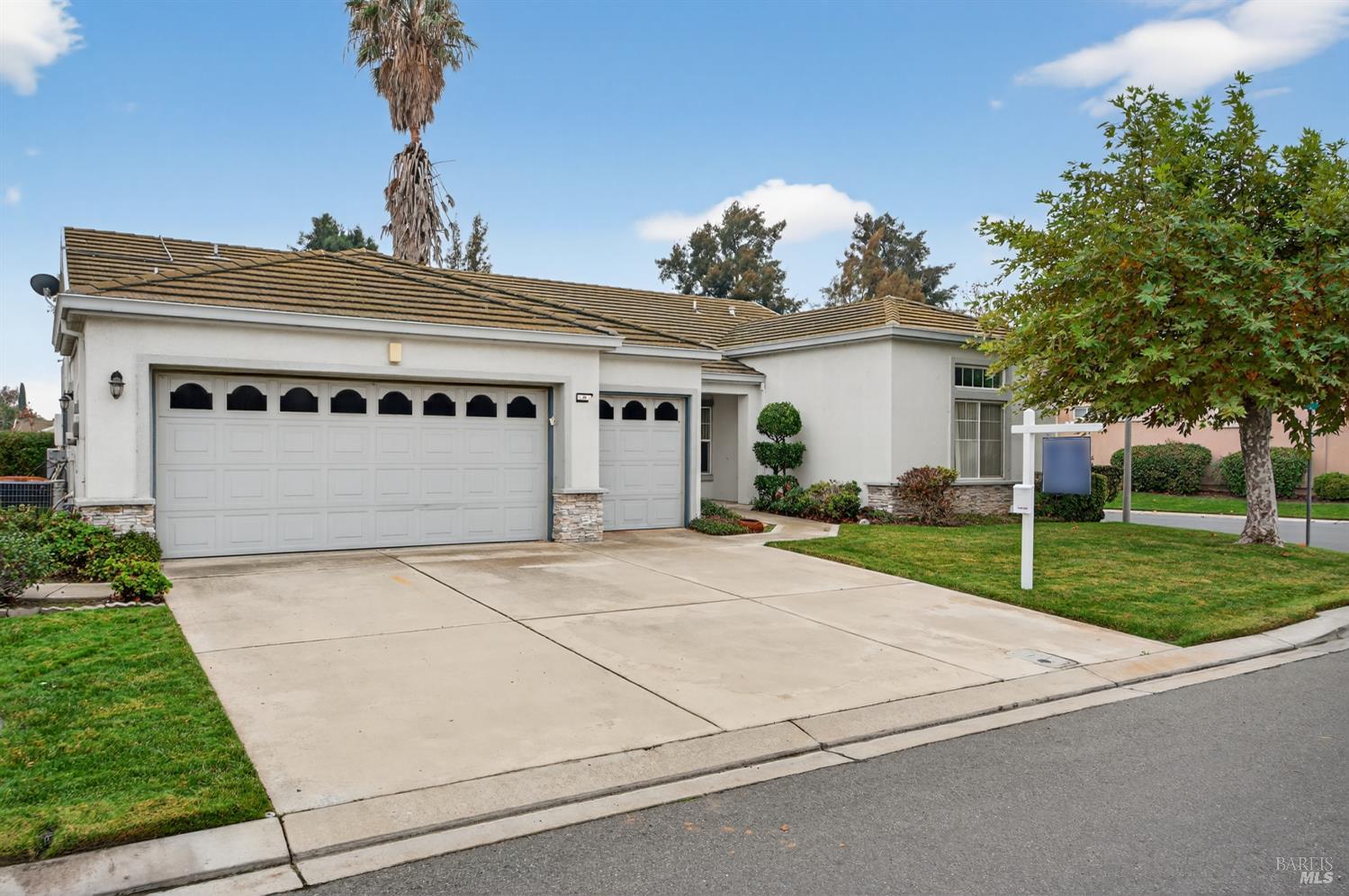 1024 Vintage Drive Rio Vista, CA 94571 - Photo 3 of 52 a front view of a house with a yard and garage