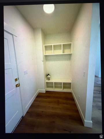 952 East Shilow Road, Unit 131 Erda, UT 84074 - Photo 6 of 12 Entryway featuring built-in storage with a bench, upper shelving, and wood-finish flooring