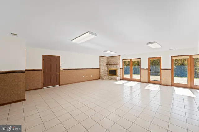 a view of an empty room with windows