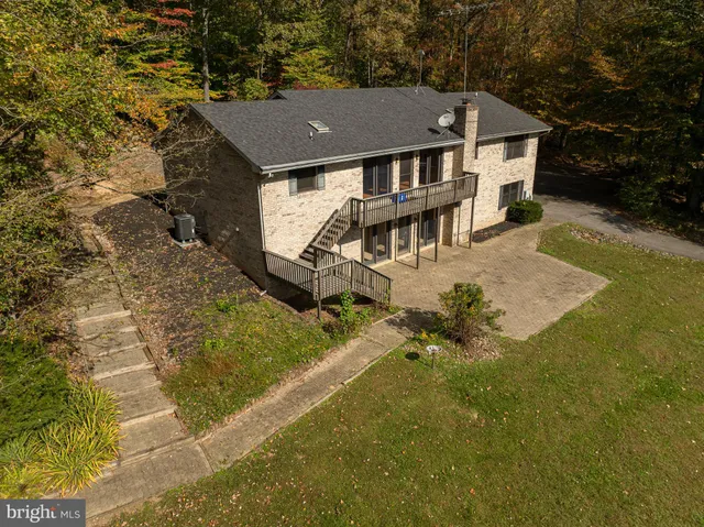 a aerial view of a house with a yard
