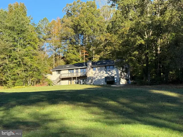 a view of a house with a big yard