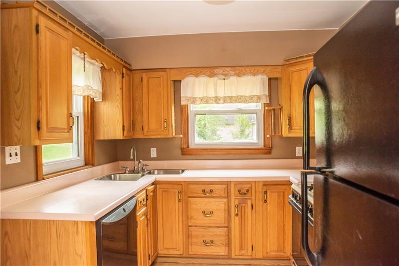 745 Wildlife Lodge Road Lower Burrell, PA 15068 - Photo 3 of 16 Enjoy the view of the private backyard while preparing meals with everything at your fingertips!