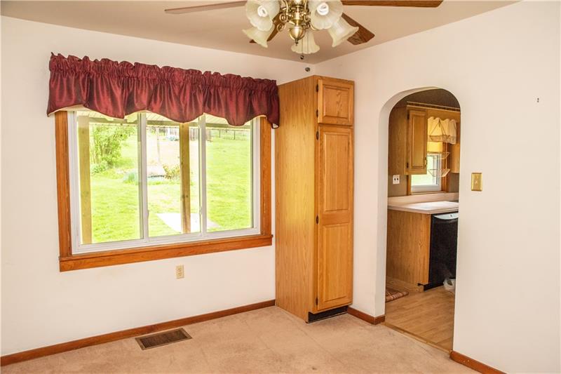 745 Wildlife Lodge Road Lower Burrell, PA 15068 - Photo 4 of 16 Dining room looks out the to the back porch and yard with pantry for extra storage! Arched entry ways add to the character of this home!