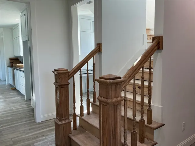 a view of a hallway with a door