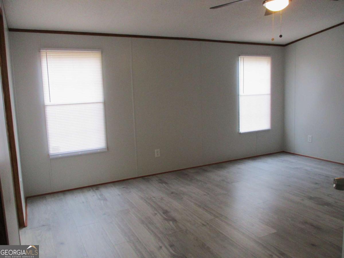 606 Cline Road Northwest Resaca, GA 30735 - Photo 25 of 49 an empty room with wooden floor and windows