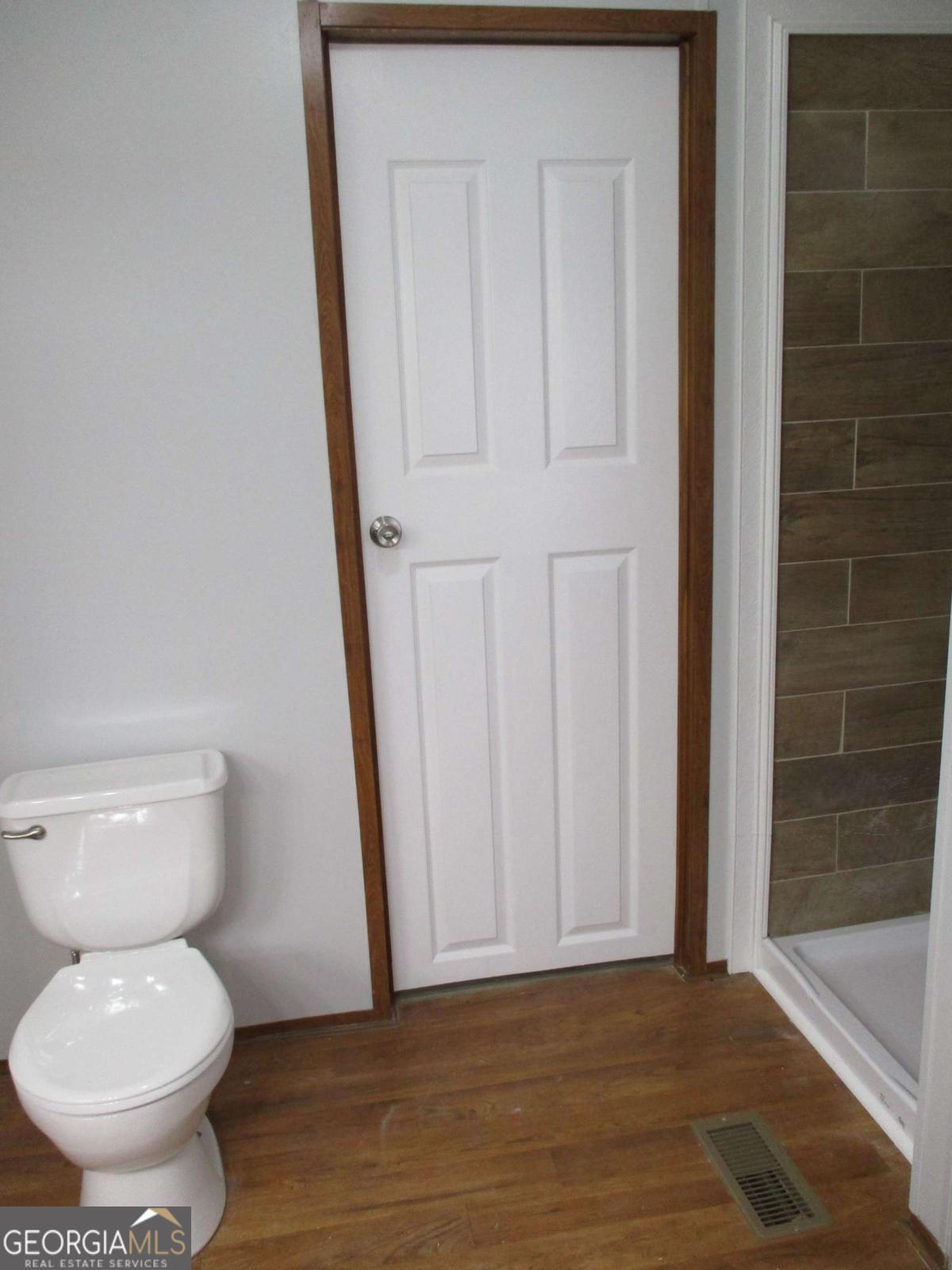 606 Cline Road Northwest Resaca, GA 30735 - Photo 30 of 49 a bathroom with a toilet and a shower