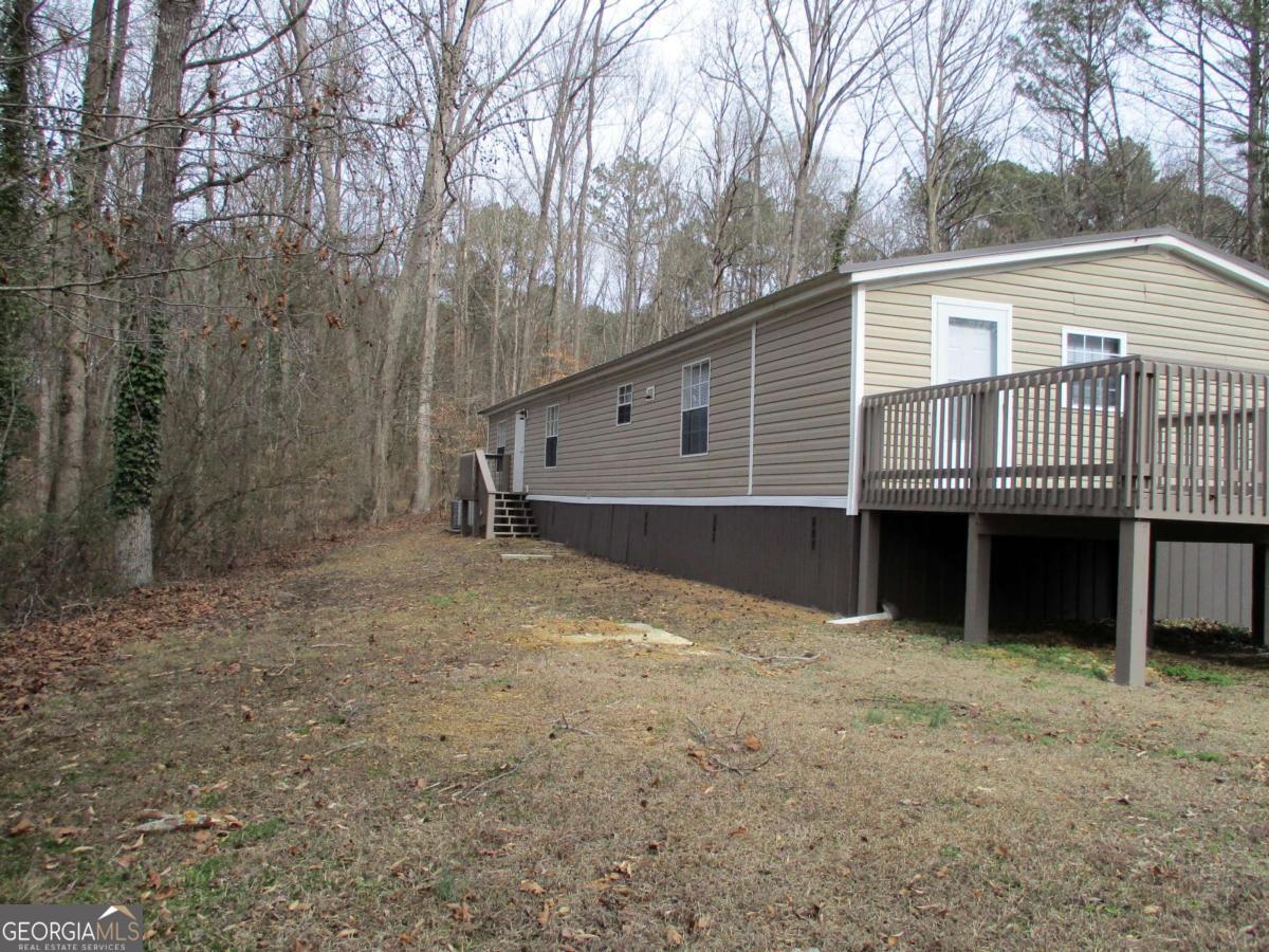 606 Cline Road Northwest Resaca, GA 30735 - Photo 38 of 49 a view of a house with a backyard and a tree