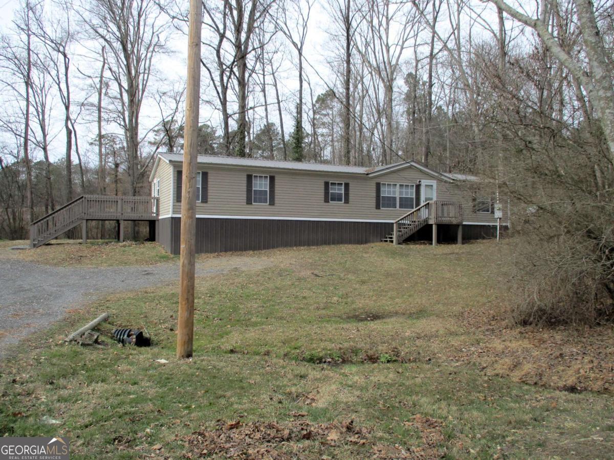 606 Cline Road Northwest Resaca, GA 30735 - Photo 48 of 49 a house with trees in the background