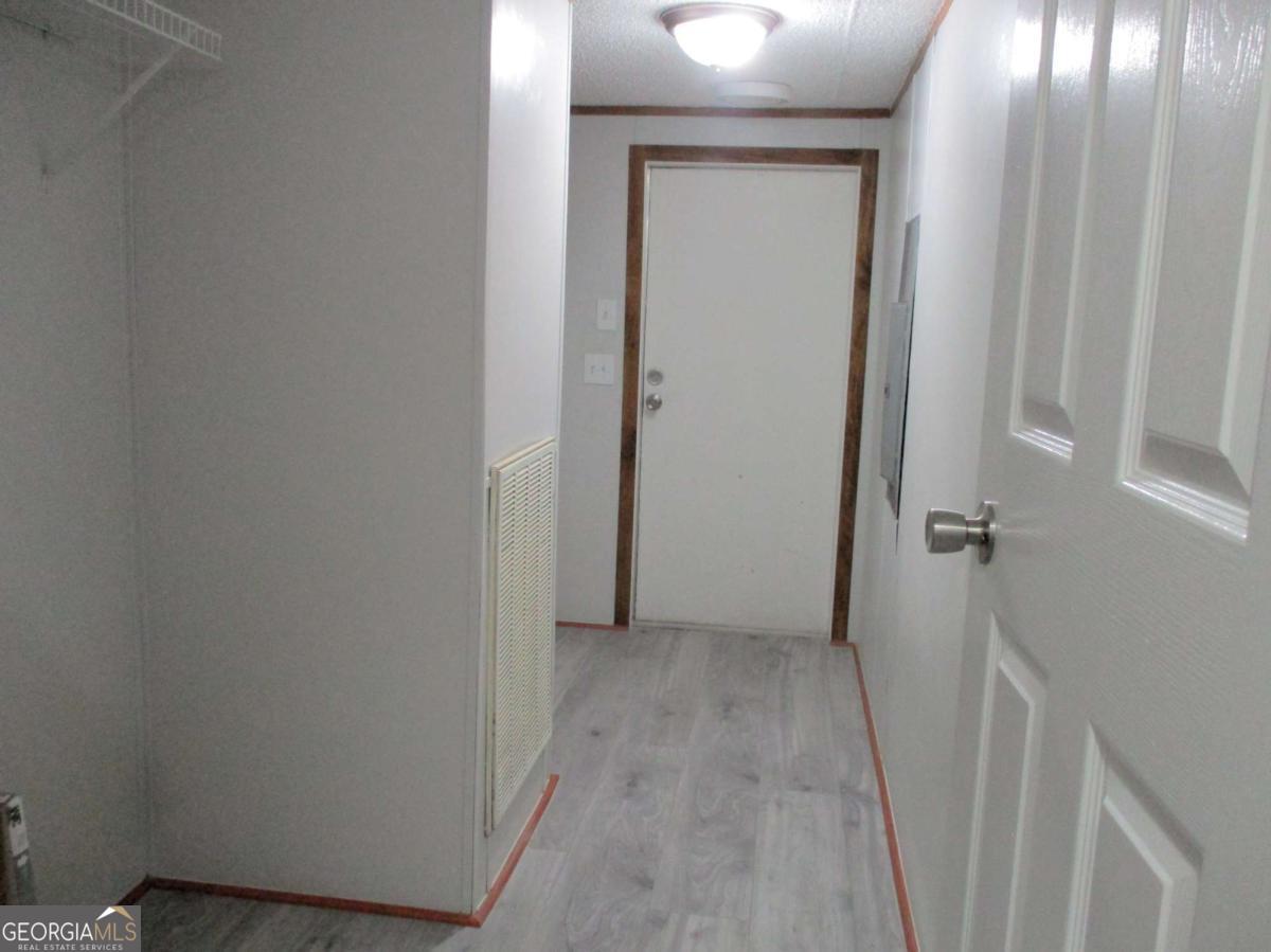 606 Cline Road Northwest Resaca, GA 30735 - Photo 7 of 49 a view of a hallway with wooden floor