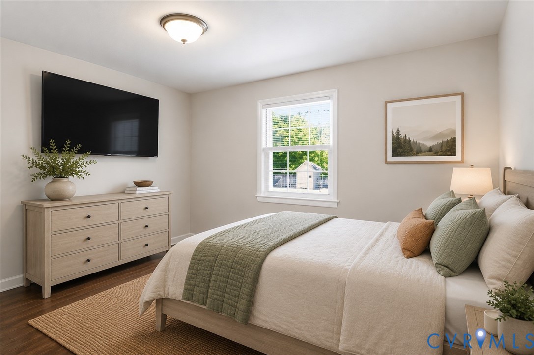 15503 Eppes Road Dewitt, VA 23840 - Photo 13 of 22 a bedroom with a large bed and a flat screen tv