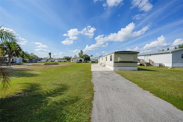 a view of a backyard with ocean view