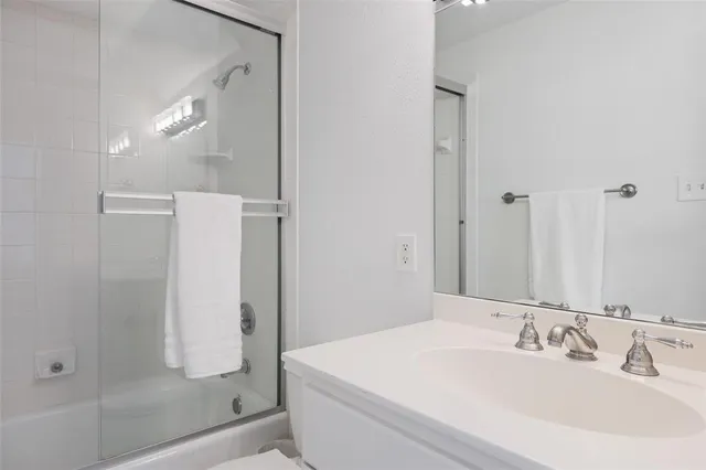 a bathroom with a bathtub and a sink