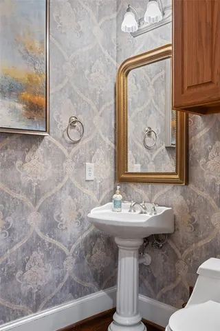 a bathroom with a sink and mirror
