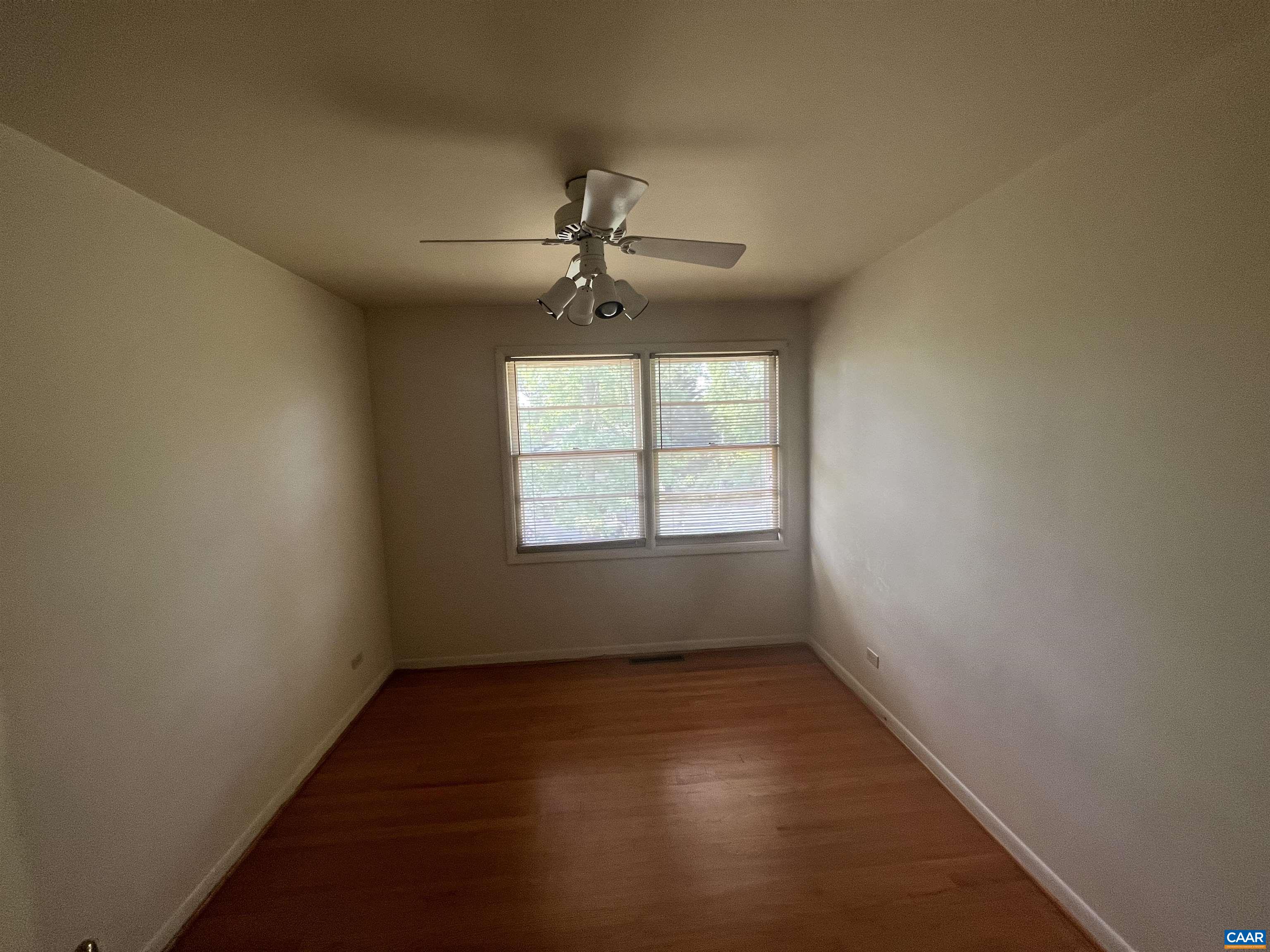 127 North Bennington Road Charlottesville, VA 22901 - Photo 11 of 29 an empty room with a window and a fan