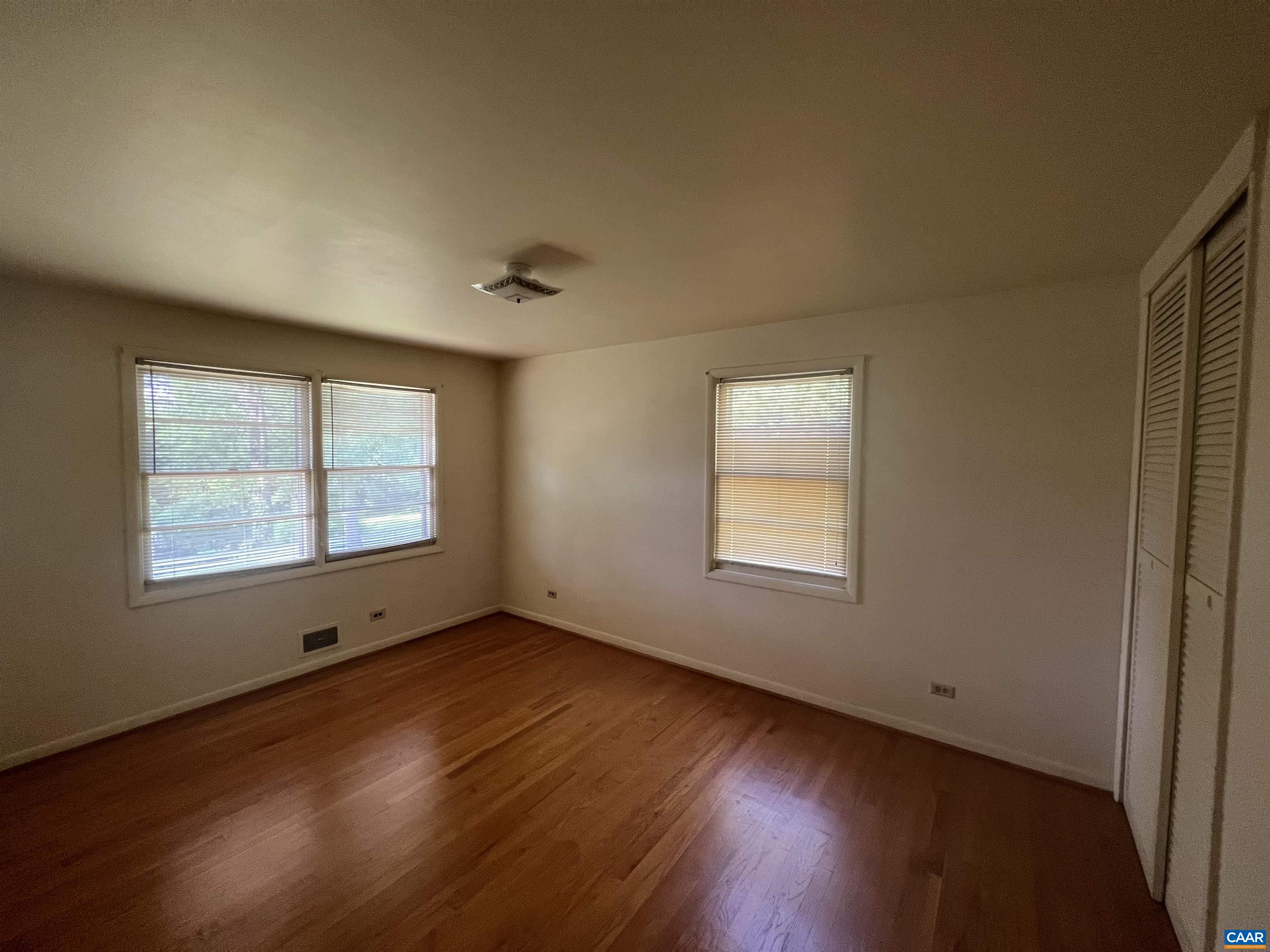 127 North Bennington Road Charlottesville, VA 22901 - Photo 12 of 29 a view of an empty room with wooden floor and a window