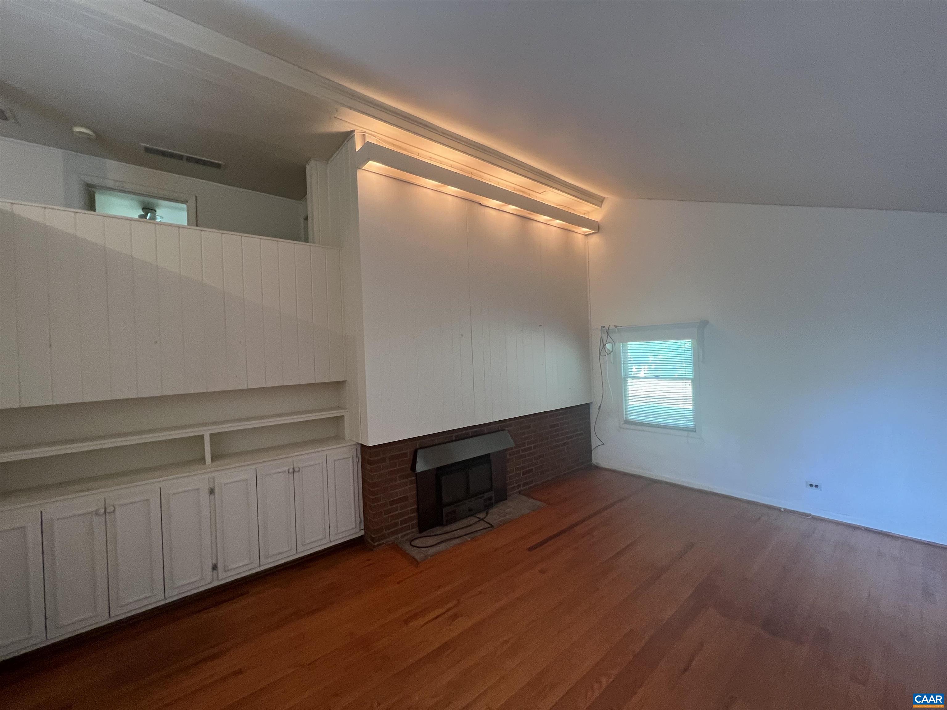 127 North Bennington Road Charlottesville, VA 22901 - Photo 4 of 29 a view of an empty room with wooden floor and a window