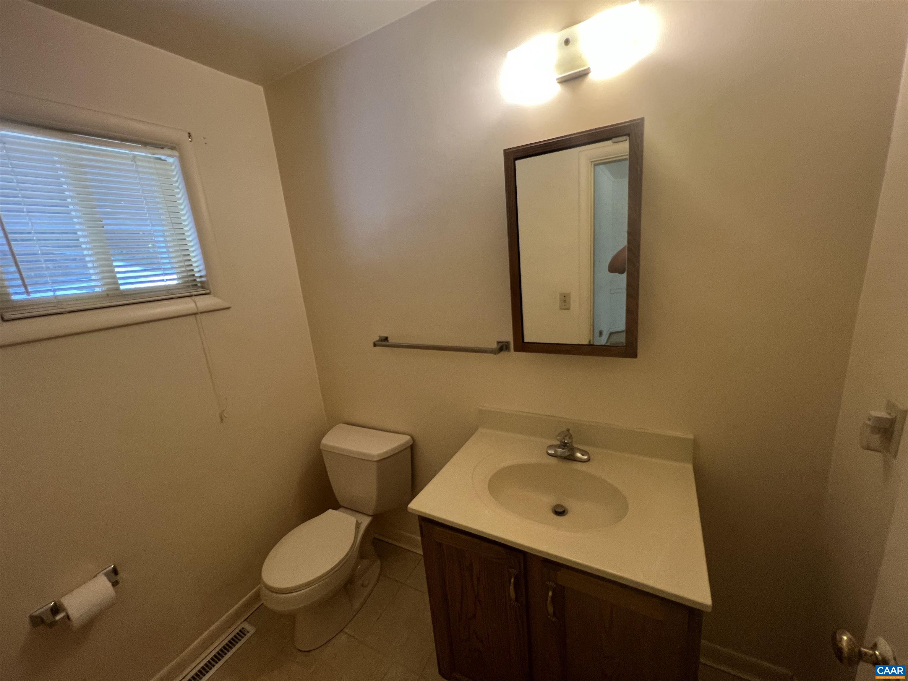 127 North Bennington Road Charlottesville, VA 22901 - Photo 6 of 29 a bathroom with a toilet sink and mirror
