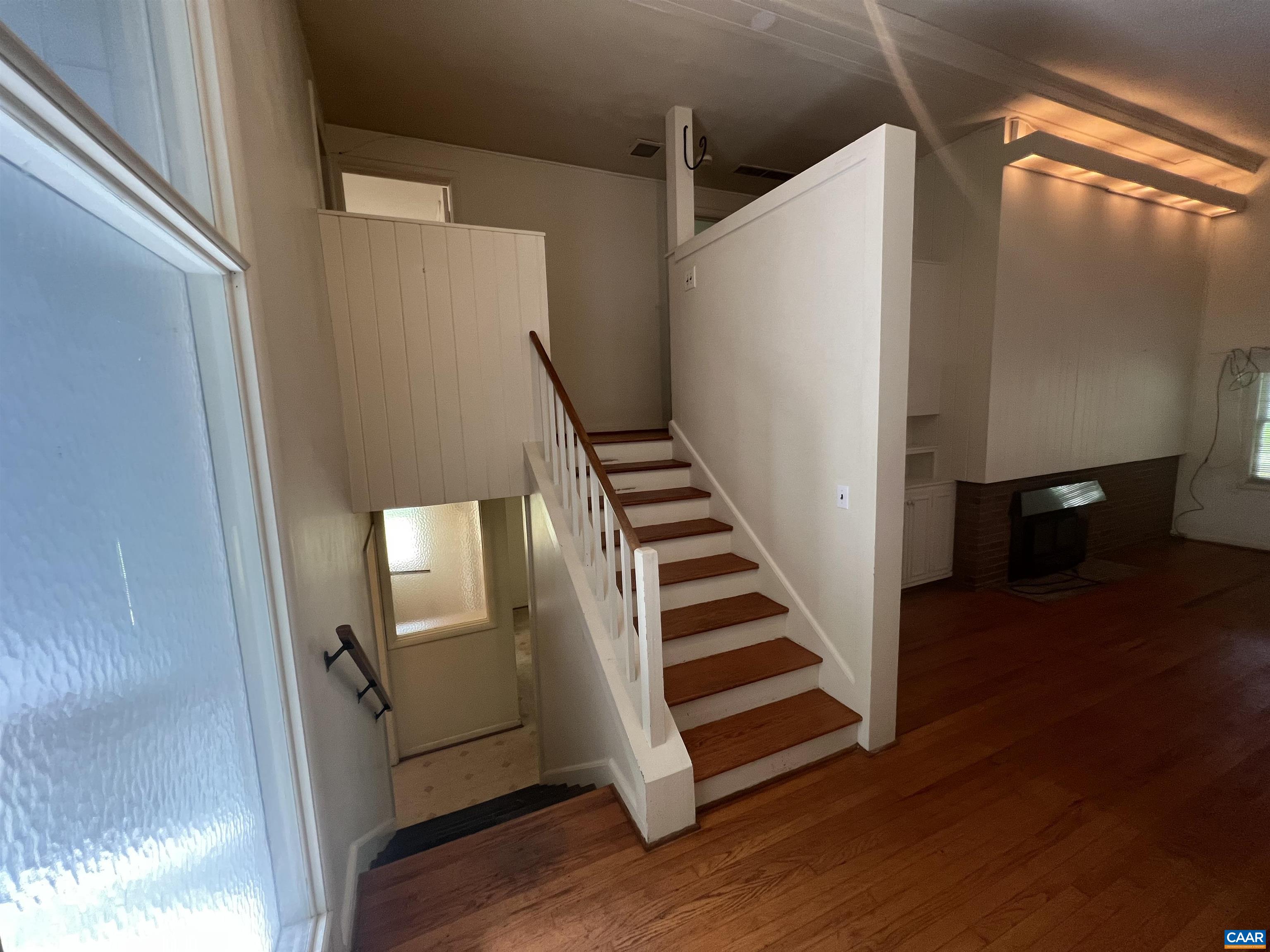 127 North Bennington Road Charlottesville, VA 22901 - Photo 7 of 29 a view of a hallway with wooden floor and stairs