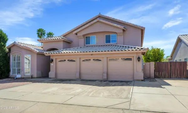 a front view of a house with a garage
