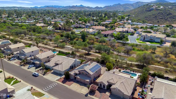 an aerial view of residential houses with outdoor space