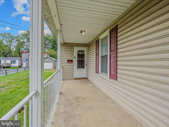 a view of a porch with furniture