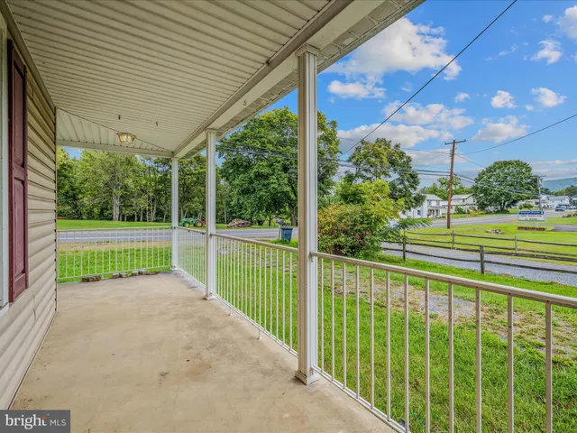 a view of a porch and garden