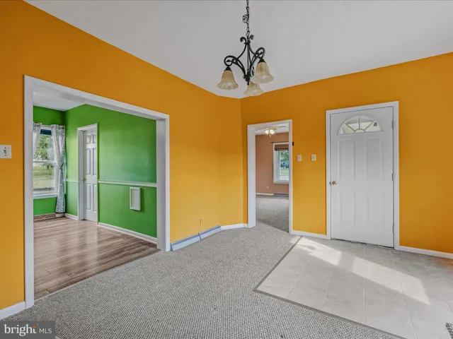 a view of a hallway with a yellow space