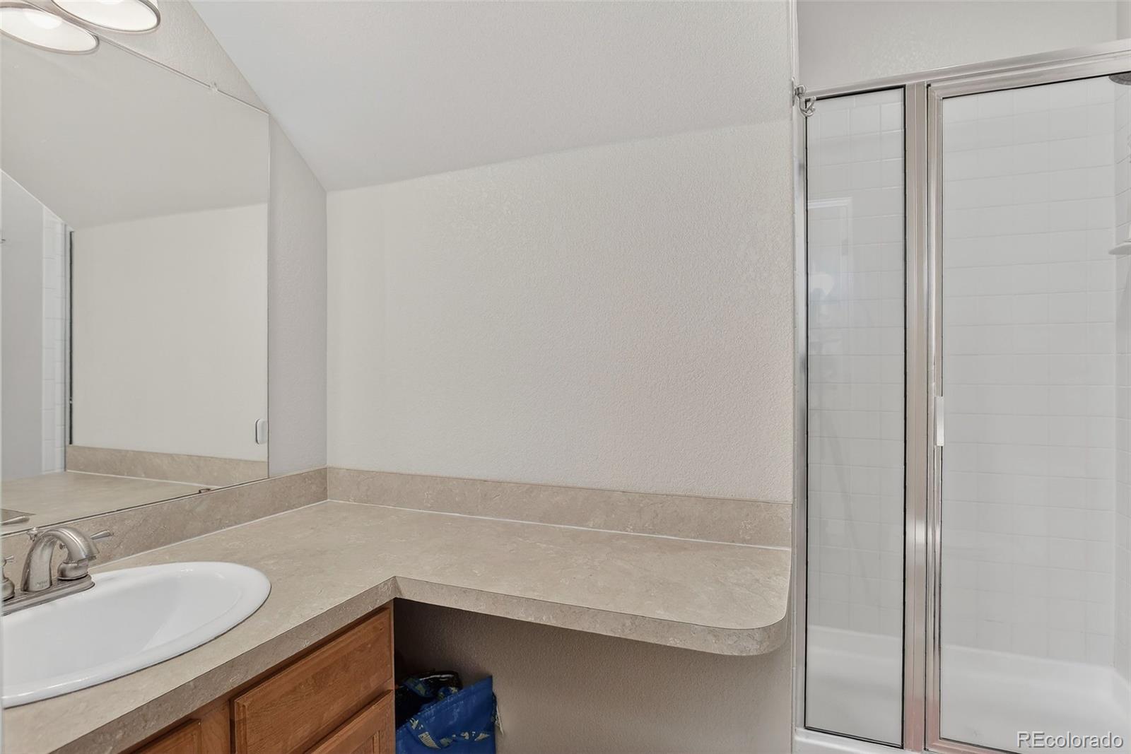 1902 Grove Street Boulder, CO 80302 - Photo 25 of 38 a bathroom with a sink and a mirror