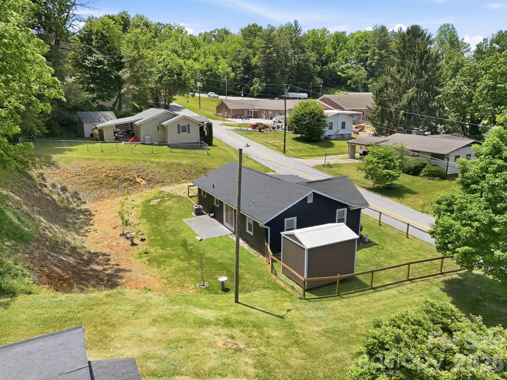 197 Mulberry Street Clyde, NC 28721 - Photo 28 of 31 a view of a house with a yard