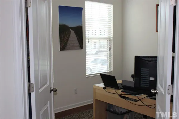 a view of a workspace with a window and storage