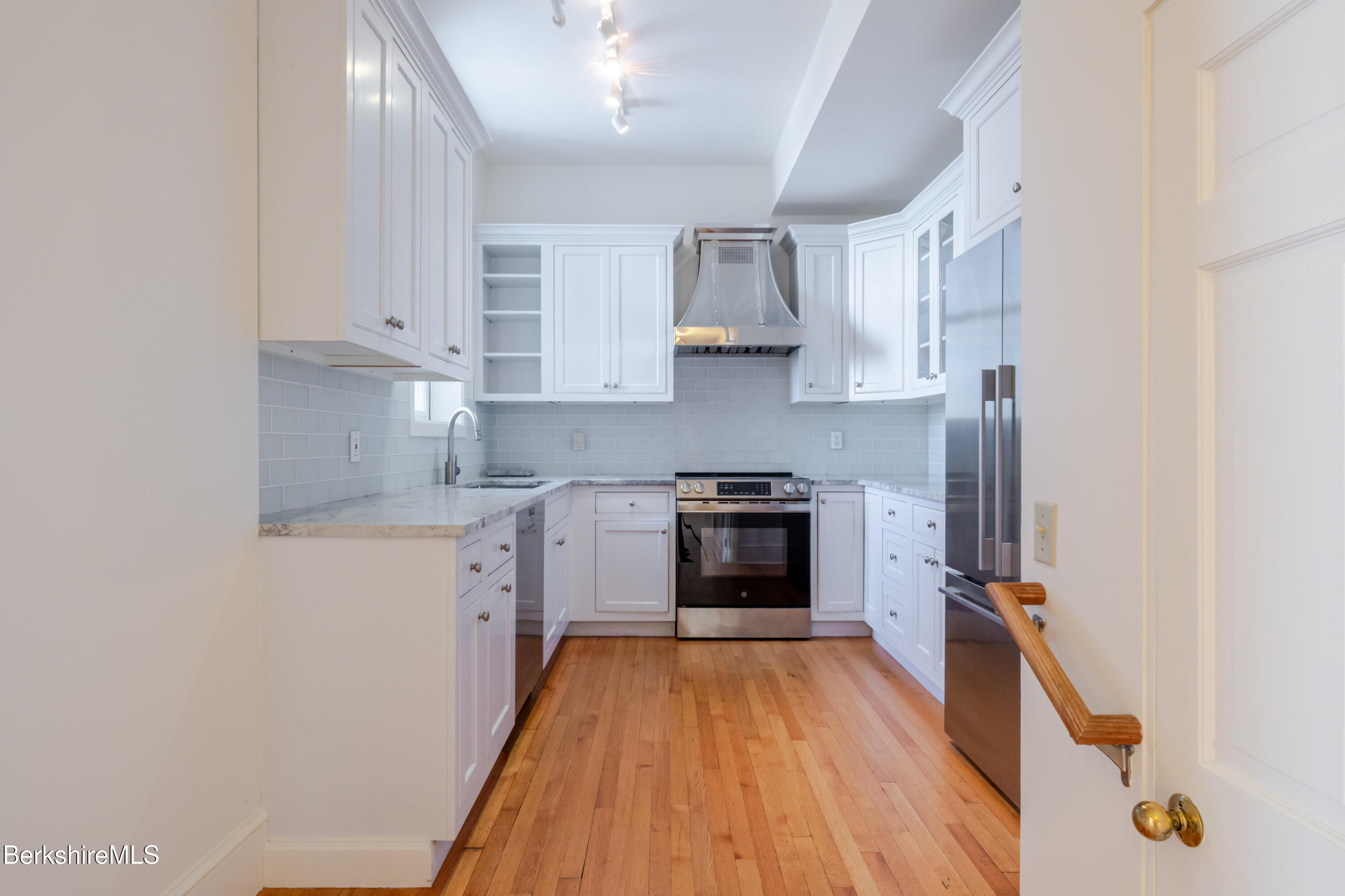 200 Old Stockbridge Road Lenox, MA 01240 - Photo 12 of 29 a kitchen with stainless steel appliances a refrigerator sink and stove