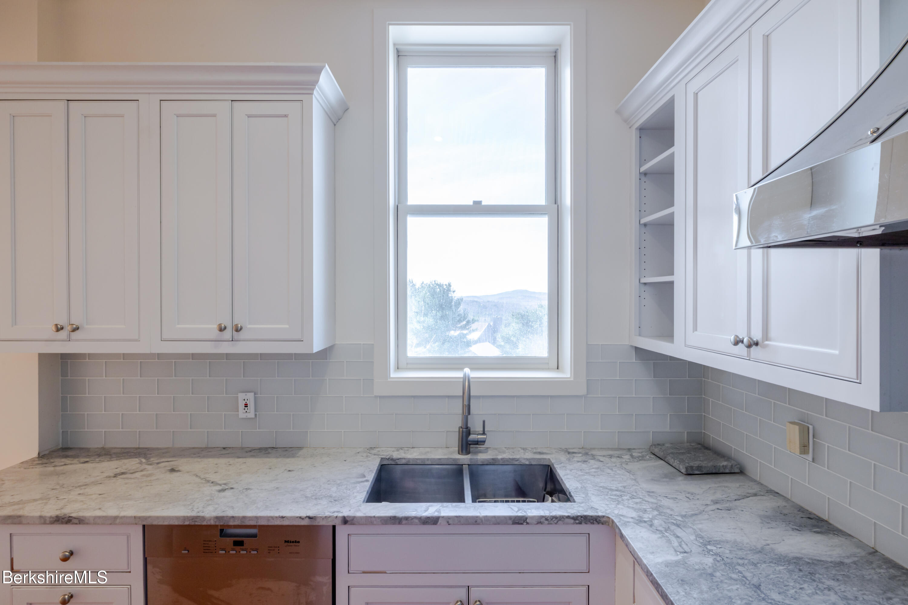 200 Old Stockbridge Road Lenox, MA 01240 - Photo 13 of 29 a kitchen with granite countertop white cabinets and window