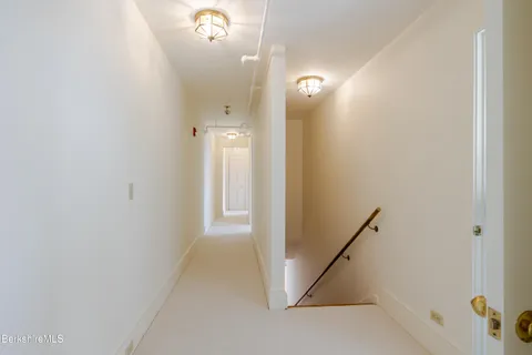 a bedroom with a bed and a fireplace