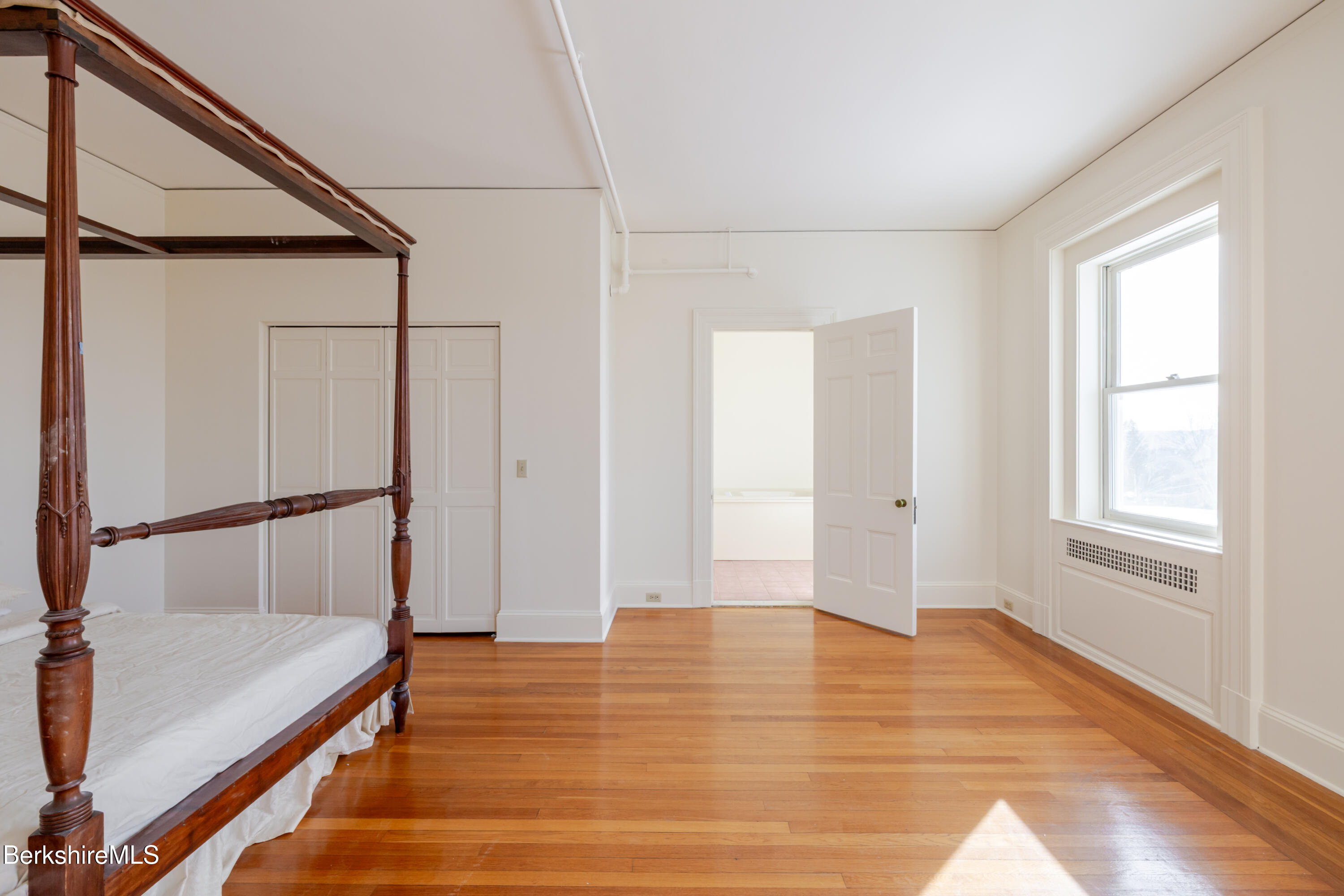 200 Old Stockbridge Road Lenox, MA 01240 - Photo 19 of 29 a view of an empty room with wooden floor and a window