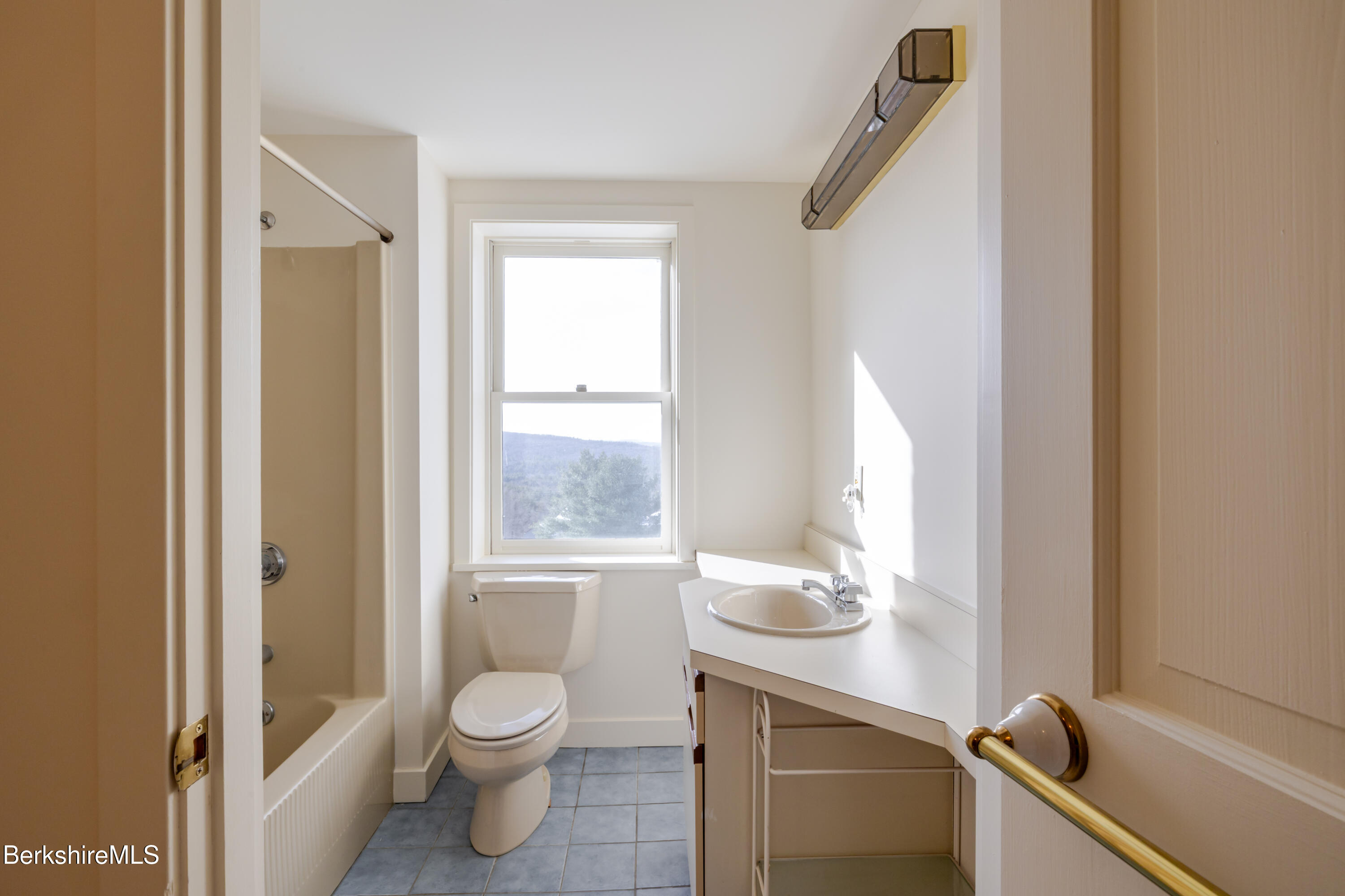 200 Old Stockbridge Road Lenox, MA 01240 - Photo 26 of 29 a bathroom with a granite countertop sink toilet and shower