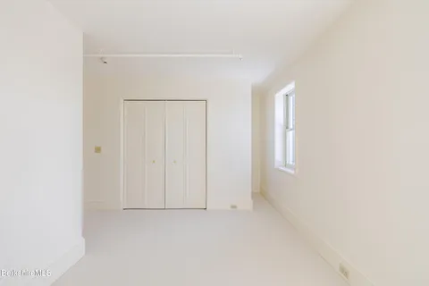 a front view of a building with many windows