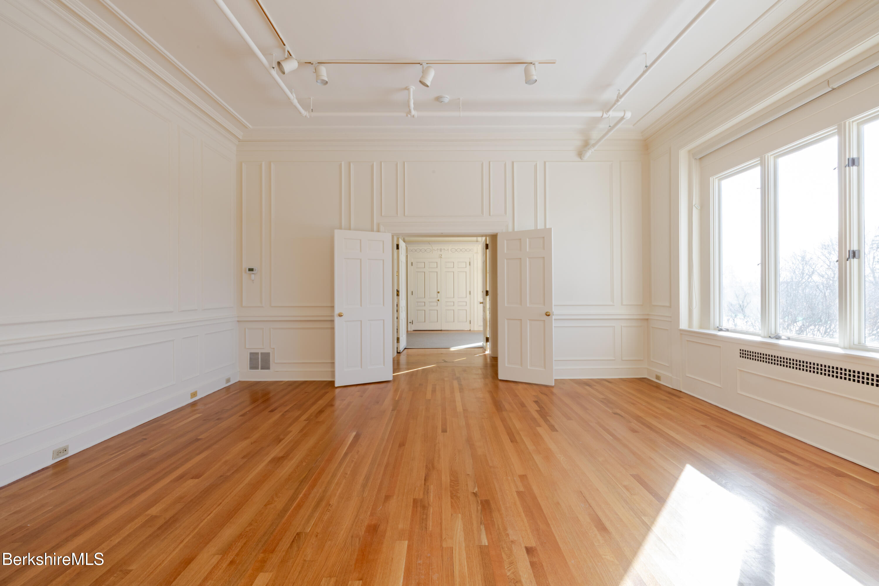 200 Old Stockbridge Road Lenox, MA 01240 - Photo 28 of 29 a view of an empty room with wooden floor and window