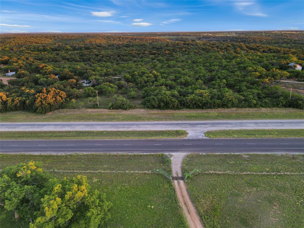 9150 Highway 6 Cisco, TX 76437 - Photo 22 of 26 Drone / aerial view of a heavily wooded area