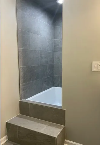 a view of a room with wooden floor and fireplace