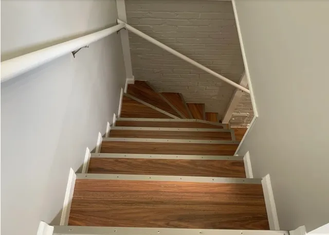 a view of entryway with wooden floor