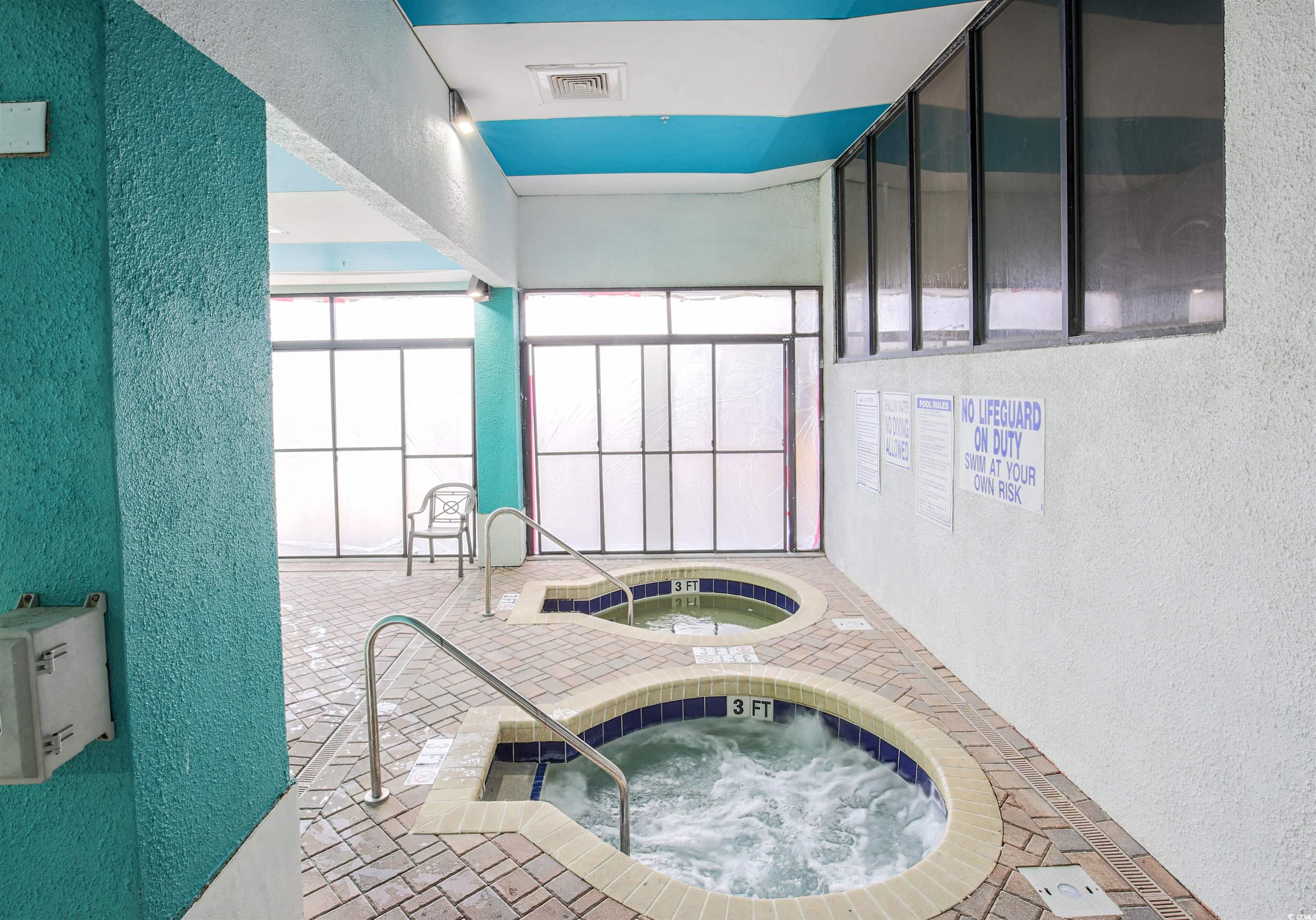 2710 North Ocean Boulevard, Unit 622 Myrtle Beach, SC 29577 - Photo 17 of 37 View of swimming pool with an in-ground hot tub