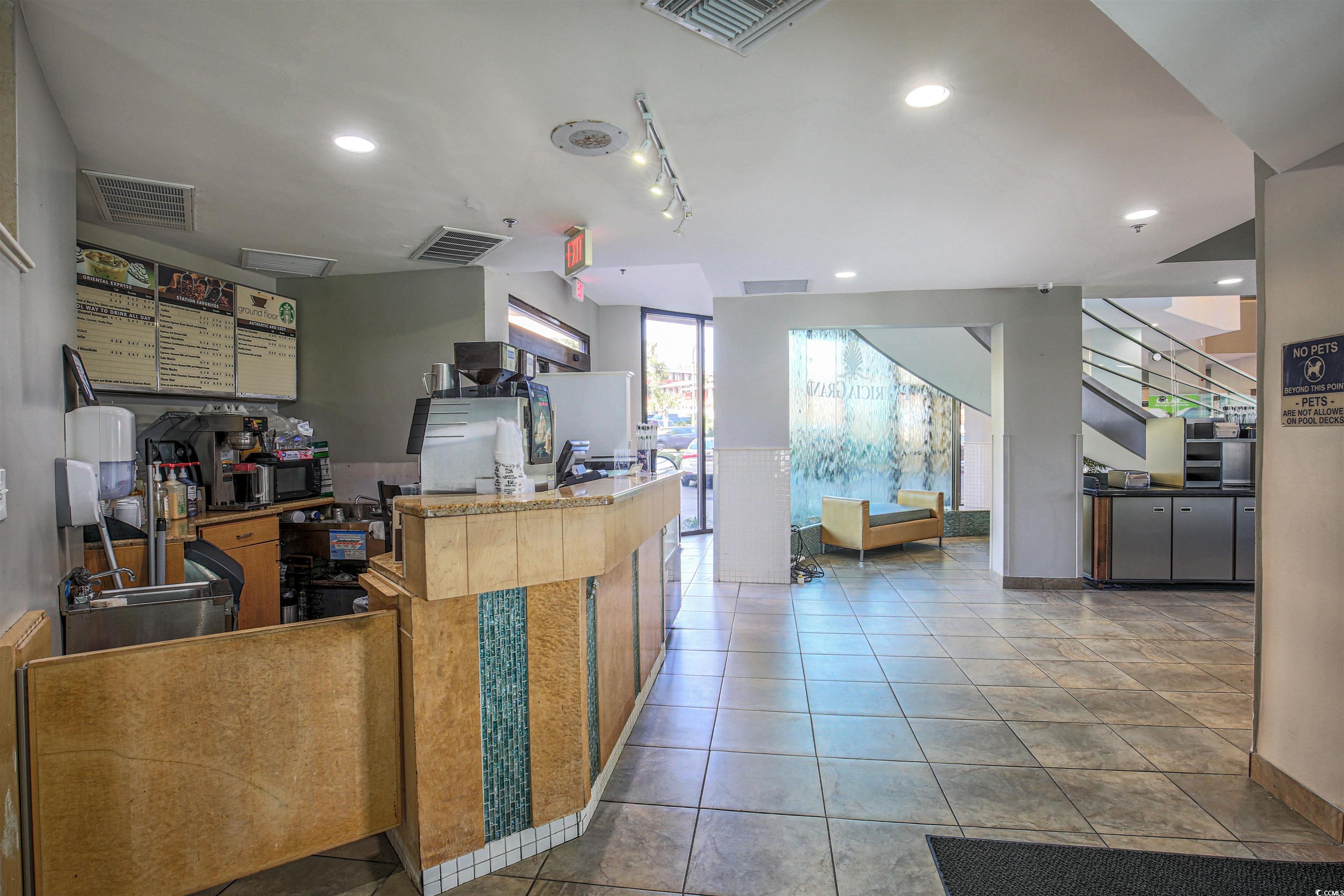 2710 North Ocean Boulevard, Unit 622 Myrtle Beach, SC 29577 - Photo 5 of 37 Kitchen featuring recessed lighting and brown cabinets