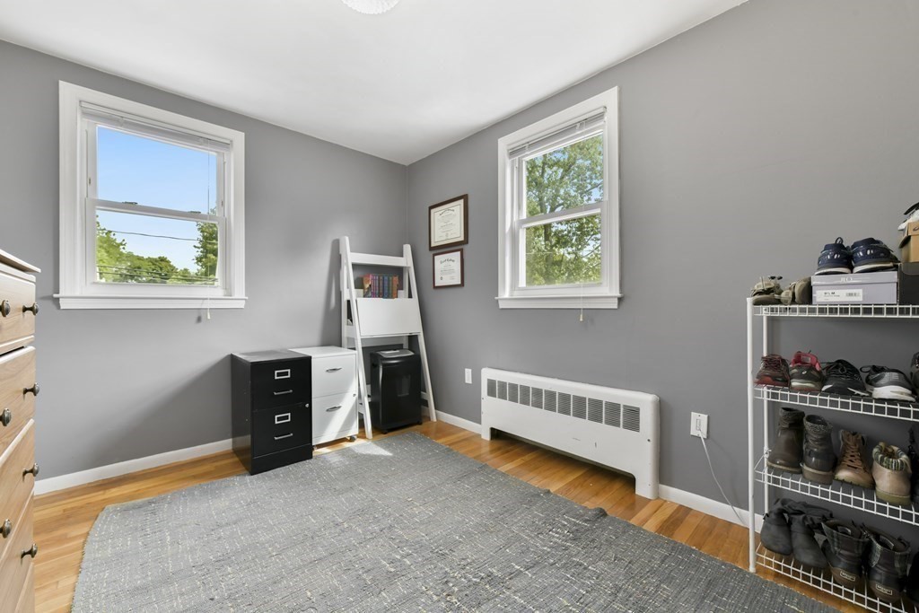 21 Stella Road Boston, MA 02131 - Photo 18 of 22 a view of living room and workspace with furniture and window