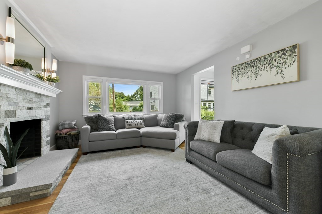21 Stella Road Boston, MA 02131 - Photo 5 of 22 a living room with furniture and a fireplace