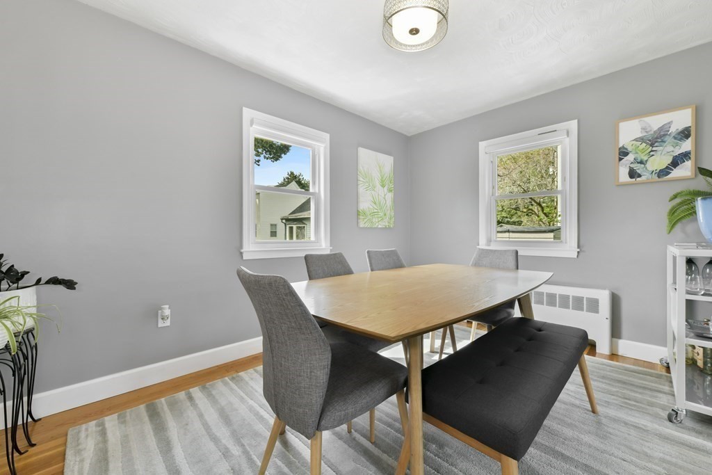 21 Stella Road Boston, MA 02131 - Photo 6 of 22 a view of a dining room with furniture and wooden floor