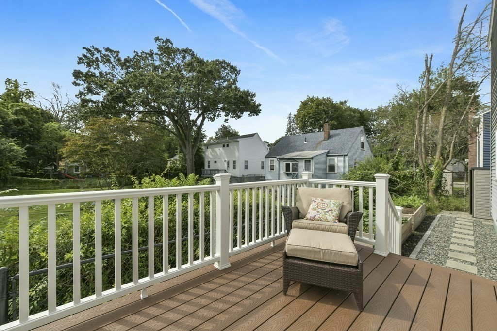 21 Stella Road Boston, MA 02131 - Photo 9 of 22 a view of a balcony with wooden floor and fence