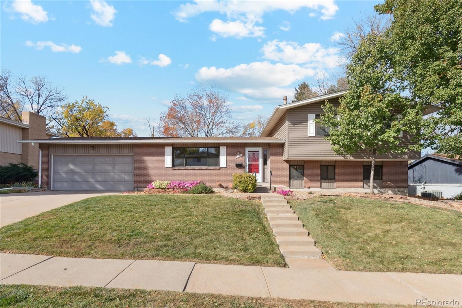a front view of house with yard outdoor seating and barbeque oven