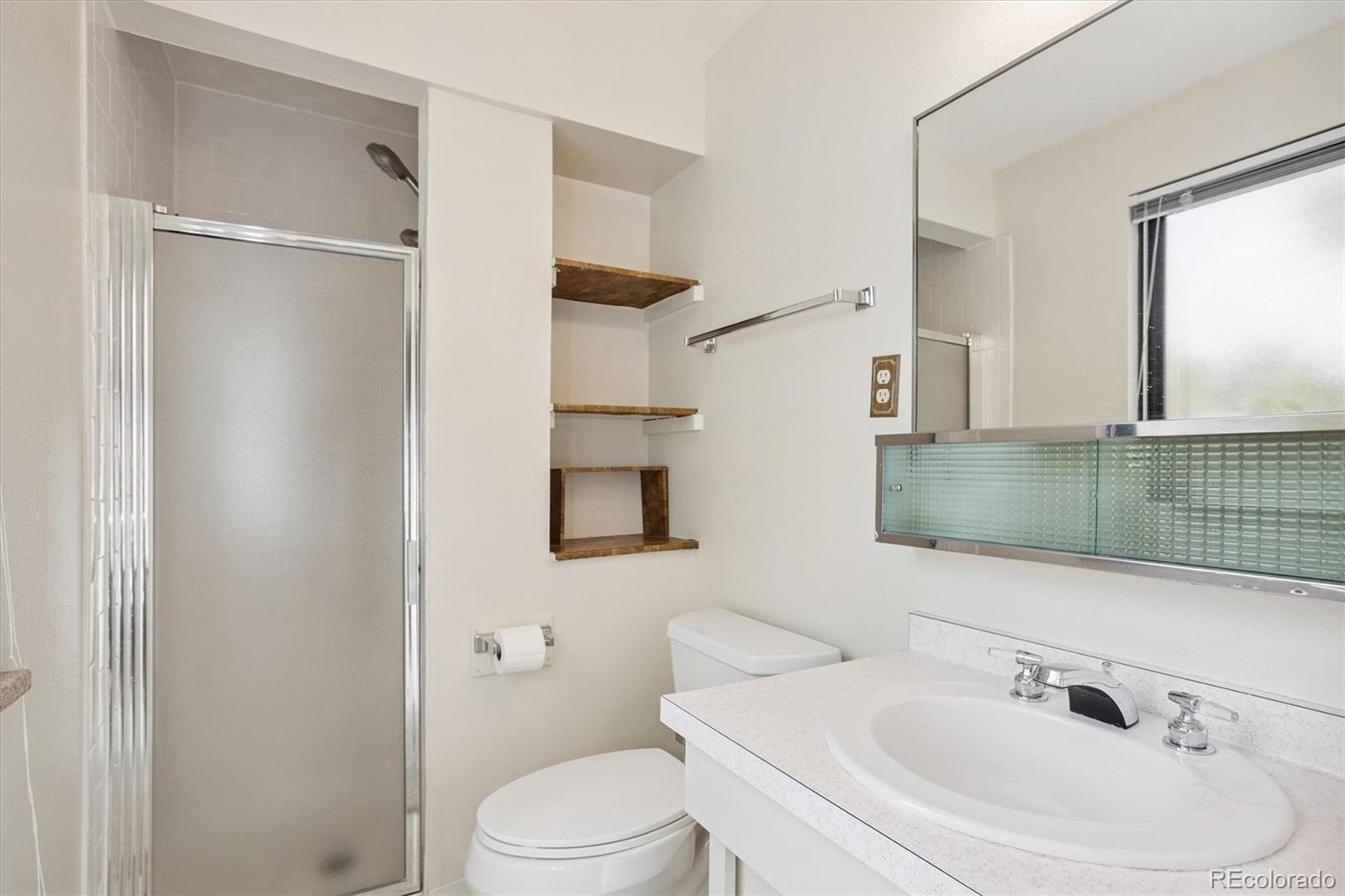 6193 South Jackson Street Centennial, CO 80121 - Photo 11 of 31 a bathroom with a sink toilet and shower