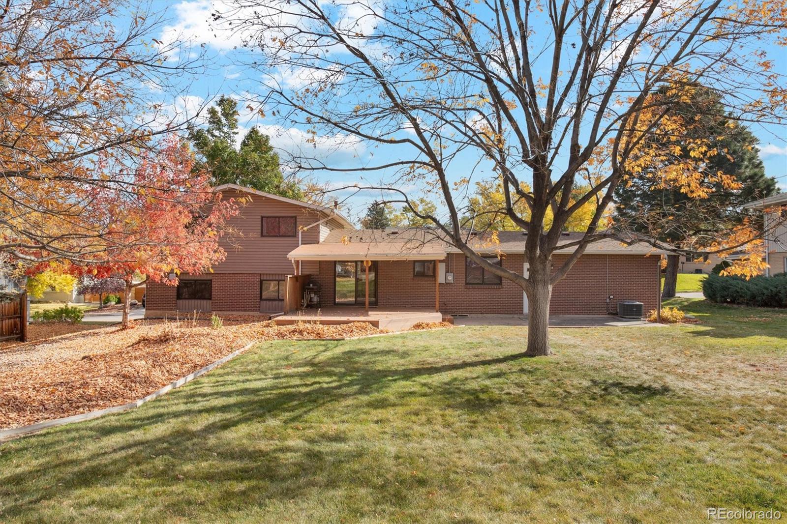 6193 South Jackson Street Centennial, CO 80121 - Photo 14 of 31 a house that has a tree in front of it